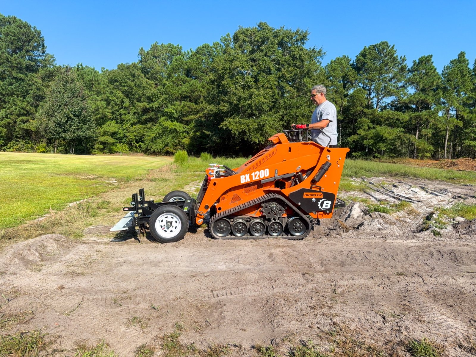 Mini skid steer using a Harley rake